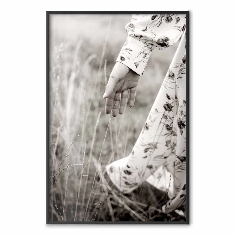 In Touch with Nature - landscape of a woman's hand among plants in a meadow