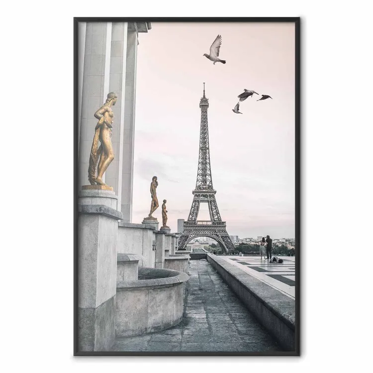 Flight to Freedom - structure with golden sculptures against the backdrop of the Eiffel Tower